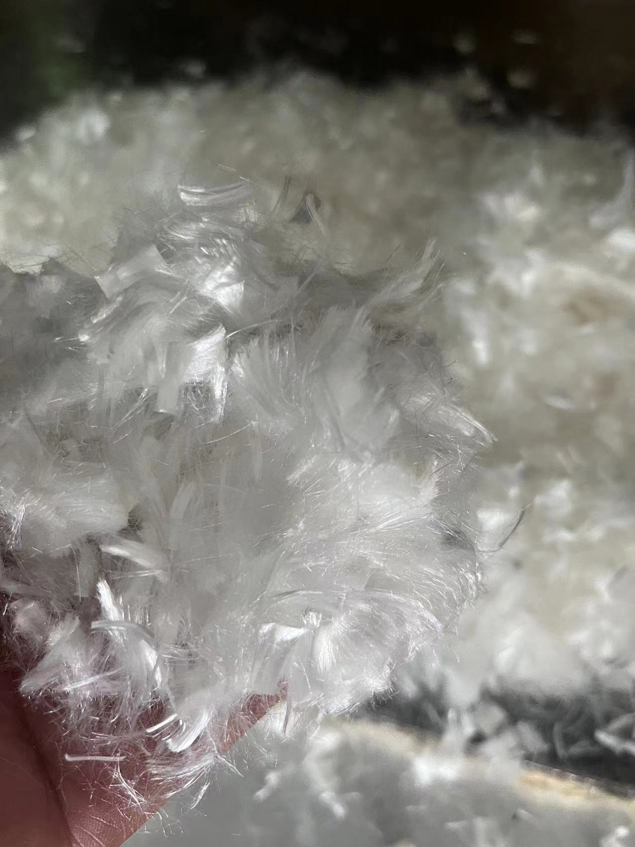 Staple UHMWPE fiber for Ultra-high Performance Engineered Cementitious Composite